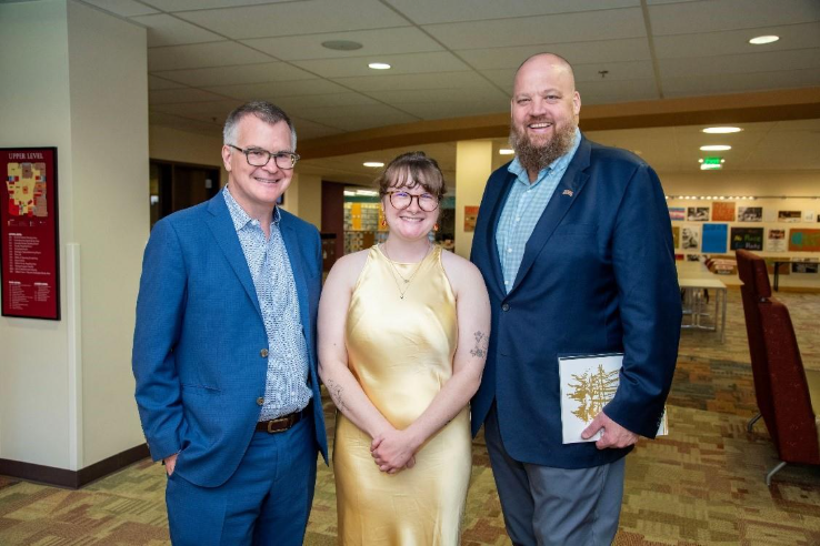 Rose McCandless stands between Dean of Libraries Michael Levine-Clark (right) and Taylor Kirkpatrick (left)