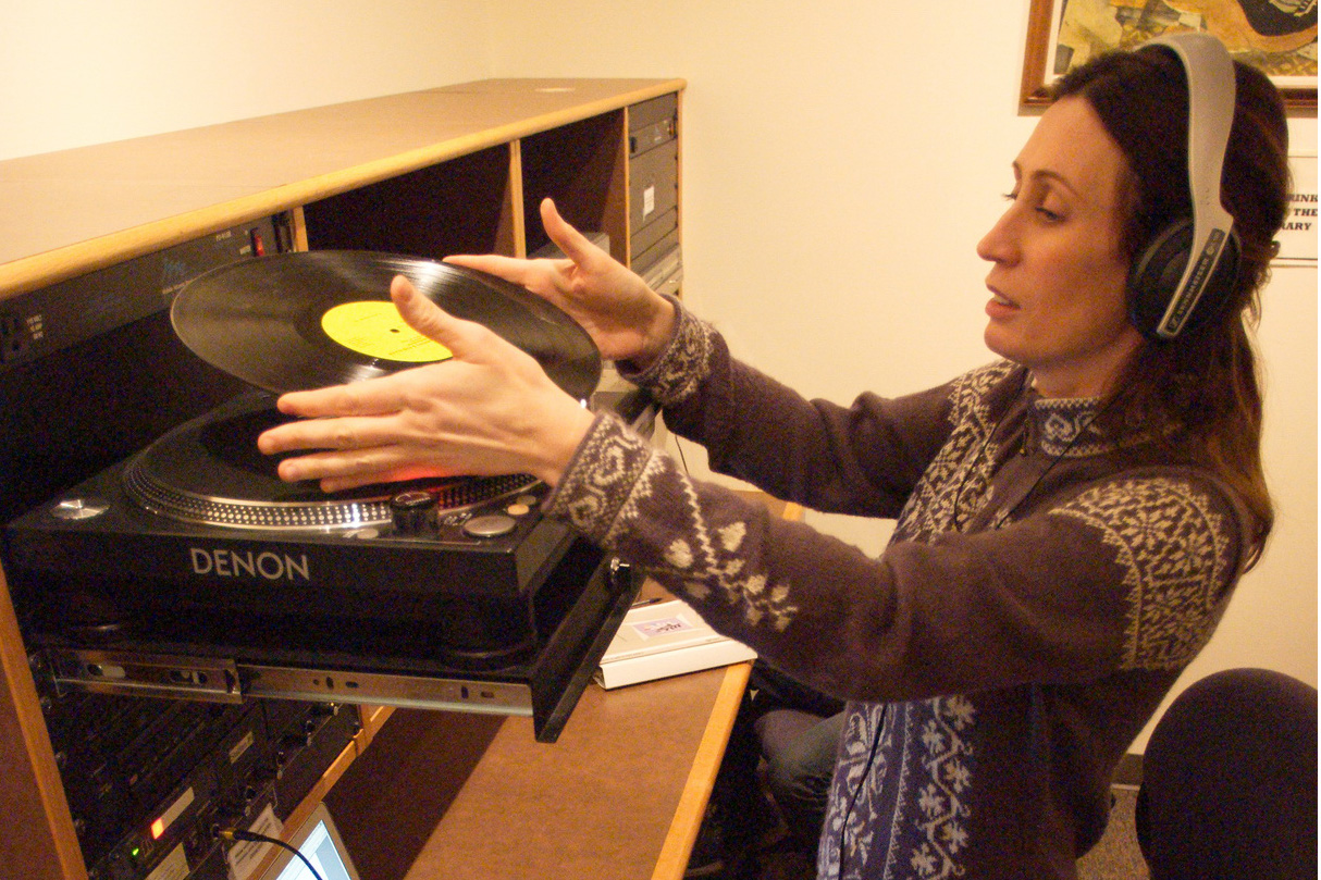 Person using the turntable and other equipment in the Music Library
